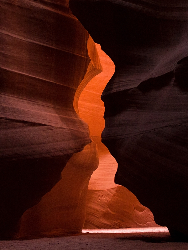 An enclosure of bright orange and red rocks at Antelope Canyon